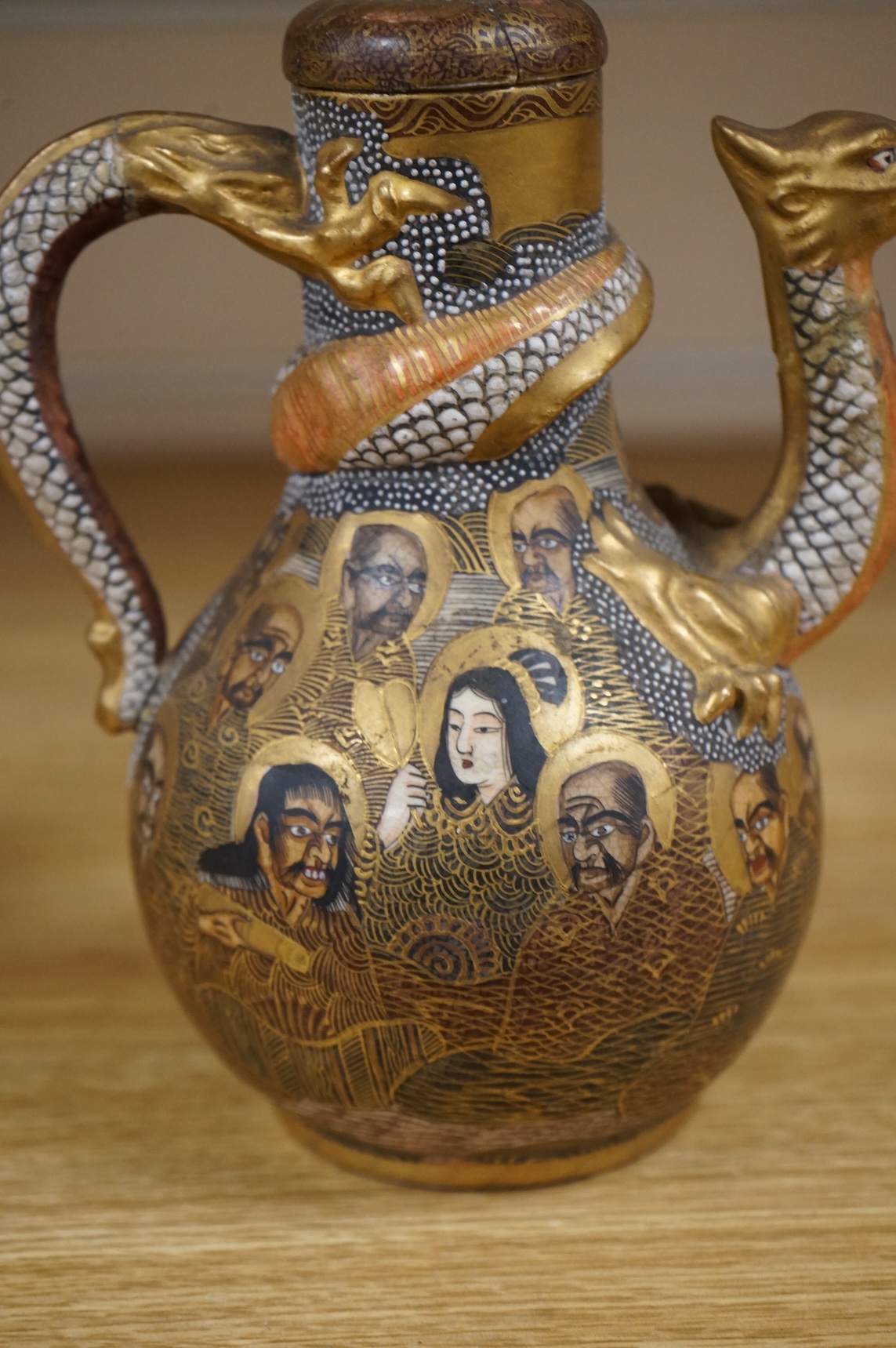 A Japanese Satsuma teapot and cover, signed, 17cm